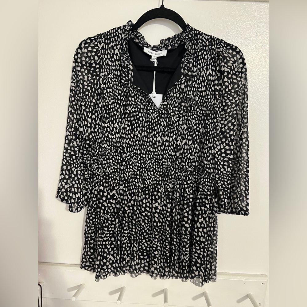 NWT Black and white patterned smocked blouse.